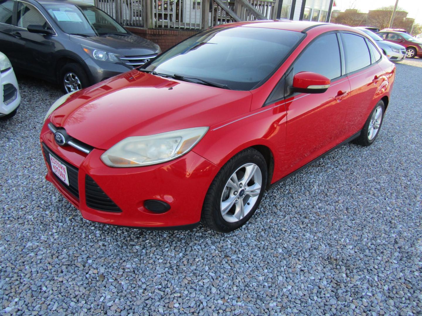2014 Red Ford Focus (1FADP3F22EL) with an 4 Cyl engine, Automatic transmission, located at 15016 S Hwy 231, Midland City, AL, 36350, (334) 983-3001, 31.306210, -85.495277 - Photo#2