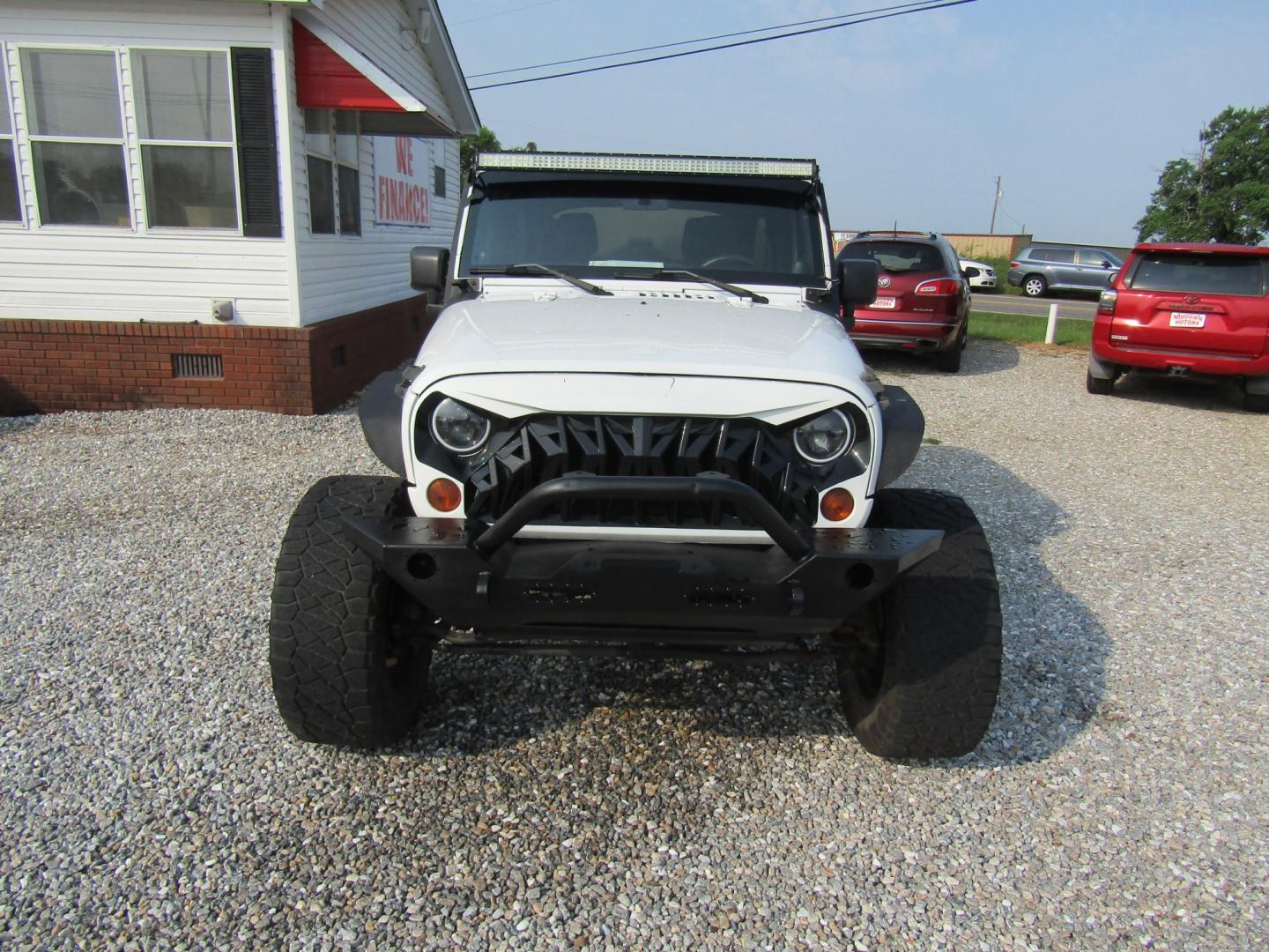 2011 White /Black Jeep Wrangler Unlimited Sport 4WD (1J4BA3H18BL) with an 3.8L V6 OHV 12V engine, Automatic transmission, located at 15016 S Hwy 231, Midland City, AL, 36350, (334) 983-3001, 31.306210, -85.495277- Photo#1