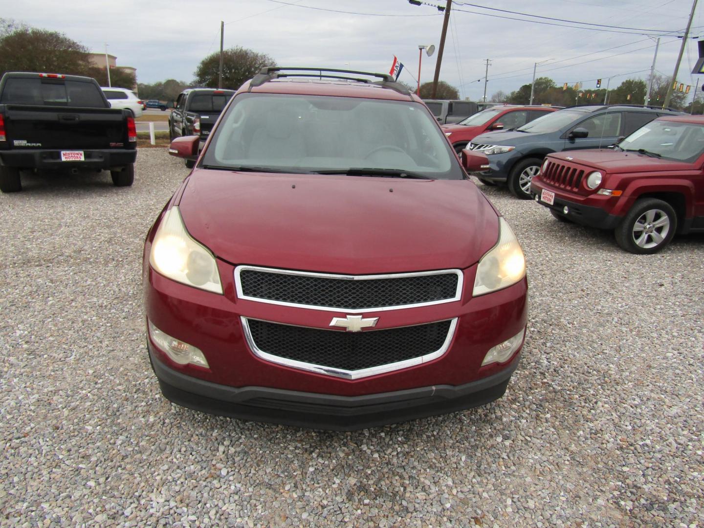 2011 Red /Gray Chevrolet Traverse 2LT FWD (1GNKRJED7BJ) with an 3.6L V6 DOHC 24V engine, Automatic transmission, located at 15016 S Hwy 231, Midland City, AL, 36350, (334) 983-3001, 31.306210, -85.495277 - Photo#1