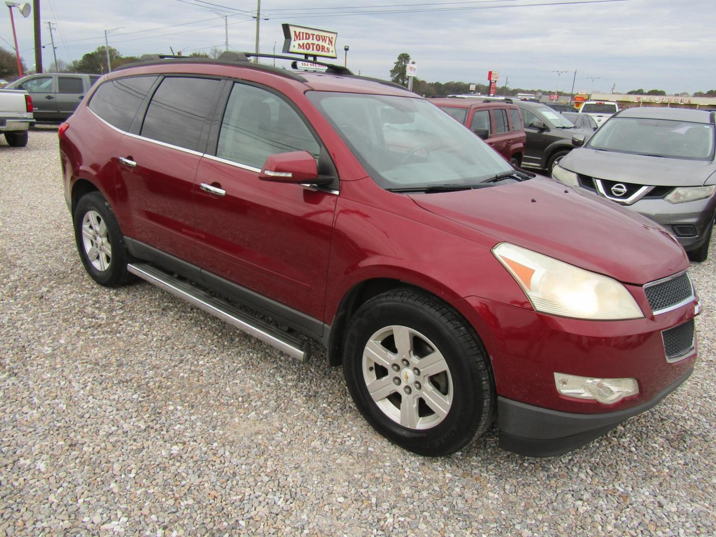 2011 Red /Gray Chevrolet Traverse 2LT FWD (1GNKRJED7BJ) with an 3.6L V6 DOHC 24V engine, Automatic transmission, located at 15016 S Hwy 231, Midland City, AL, 36350, (334) 983-3001, 31.306210, -85.495277 - Photo#0