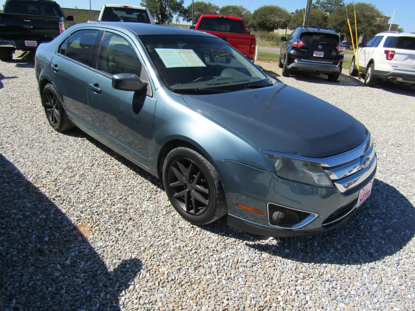 2011 Blue /Tan Ford Fusion I4 SEL (3FAHP0JA8BR) with an 2.5L L4 DOHC 16V engine, Automatic transmission, located at 15016 S Hwy 231, Midland City, AL, 36350, (334) 983-3001, 31.306210, -85.495277- Photo#0