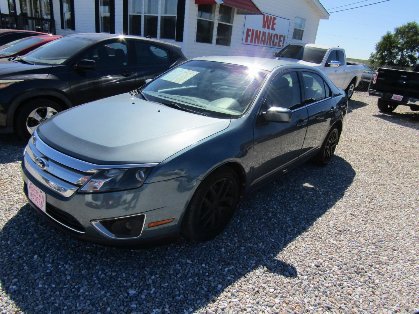 2011 Blue /Tan Ford Fusion I4 SEL (3FAHP0JA8BR) with an 2.5L L4 DOHC 16V engine, Automatic transmission, located at 15016 S Hwy 231, Midland City, AL, 36350, (334) 983-3001, 31.306210, -85.495277- Photo#2