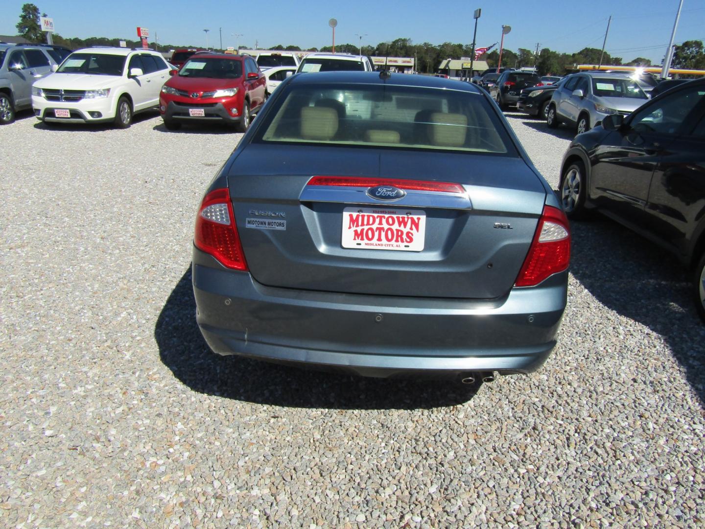 2011 Blue /Tan Ford Fusion I4 SEL (3FAHP0JA8BR) with an 2.5L L4 DOHC 16V engine, Automatic transmission, located at 15016 S Hwy 231, Midland City, AL, 36350, (334) 983-3001, 31.306210, -85.495277- Photo#5