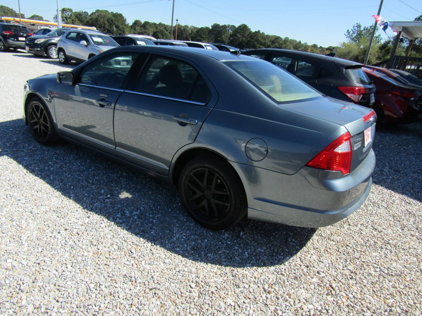 2011 Blue /Tan Ford Fusion I4 SEL (3FAHP0JA8BR) with an 2.5L L4 DOHC 16V engine, Automatic transmission, located at 15016 S Hwy 231, Midland City, AL, 36350, (334) 983-3001, 31.306210, -85.495277- Photo#4