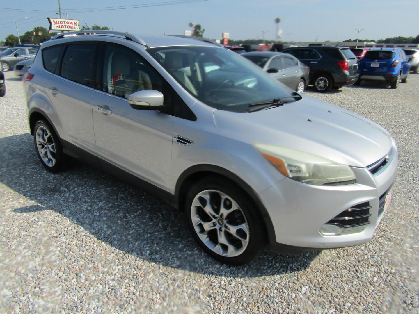 2014 Silver /Gray Ford Escape Titanium FWD (1FMCU0J96EU) with an 2.0L L4 DOHC 16V engine, Automatic transmission, located at 15016 S Hwy 231, Midland City, AL, 36350, (334) 983-3001, 31.306210, -85.495277 - Photo#0