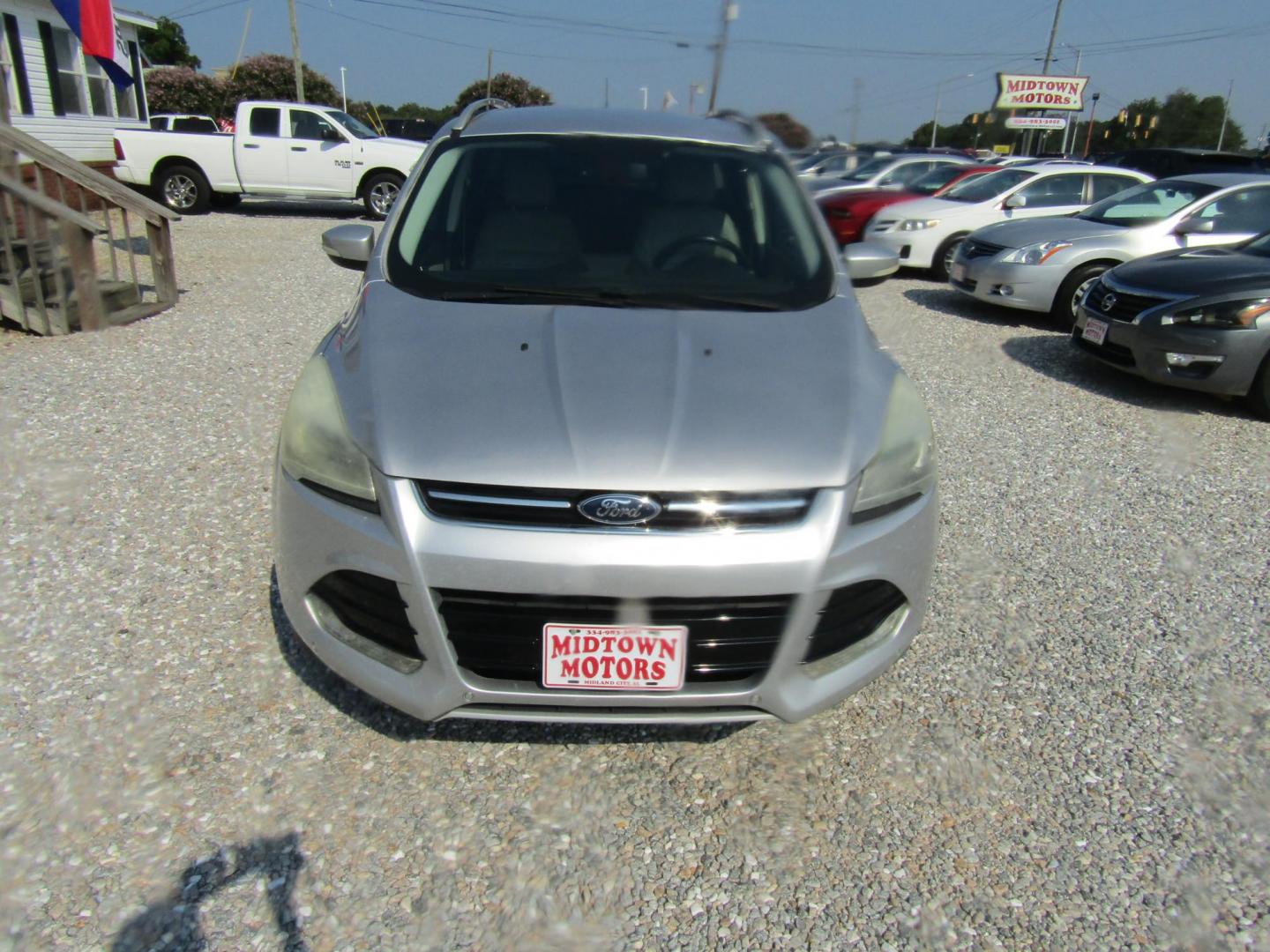 2014 Silver /Gray Ford Escape Titanium FWD (1FMCU0J96EU) with an 2.0L L4 DOHC 16V engine, Automatic transmission, located at 15016 S Hwy 231, Midland City, AL, 36350, (334) 983-3001, 31.306210, -85.495277 - Photo#1