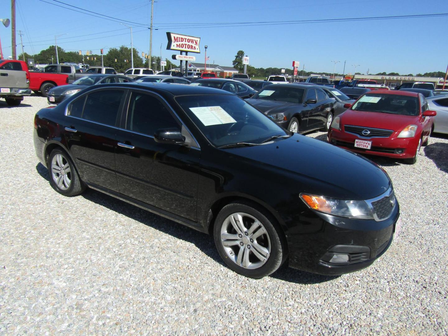 2009 Black /Gray Kia Optima EX (KNAGE228495) with an 2.4L L4 DOHC 16V engine, Automatic transmission, located at 15016 S Hwy 231, Midland City, AL, 36350, (334) 983-3001, 31.306210, -85.495277 - Photo#0