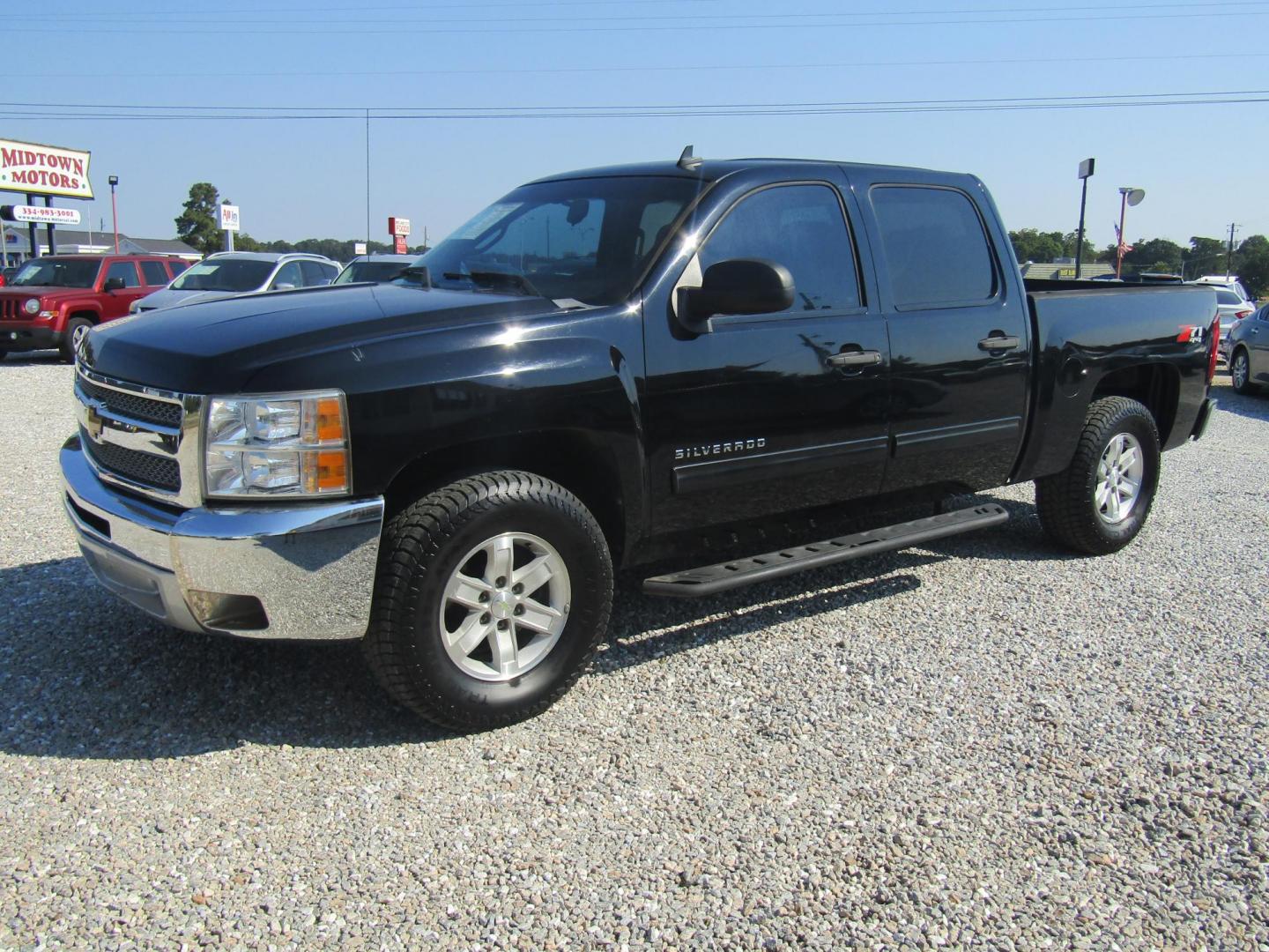 2013 Black Chevrolet Silverado 1500 LT Crew Cab 4WD (3GCPKSE70DG) with an 5.3L V8 OHV 16V FFV engine, Automatic transmission, located at 15016 S Hwy 231, Midland City, AL, 36350, (334) 983-3001, 31.306210, -85.495277 - Photo#2