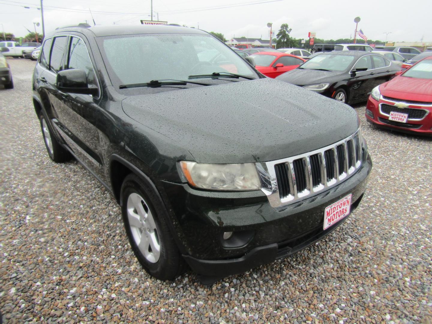 2011 Green /Black Jeep Grand Cherokee Laredo 2WD (1J4RS4GG1BC) with an 3.6L V6 DOHC 24V engine, Automatic transmission, located at 15016 S Hwy 231, Midland City, AL, 36350, (334) 983-3001, 31.306210, -85.495277 - Photo#0