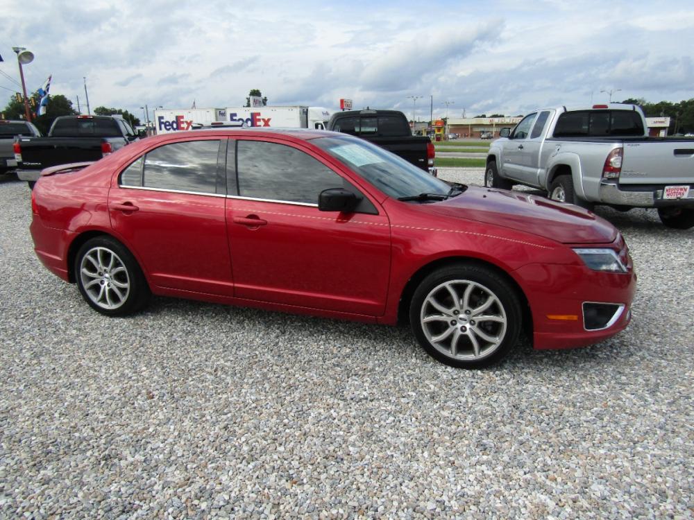 2012 Red /Black Ford Fusion SEL (3FAHP0JG1CR) with an 3.0L V6 DOHC 24V engine, Automatic transmission, located at 15016 S Hwy 231, Midland City, AL, 36350, (334) 983-3001, 31.306210, -85.495277 - Photo #0