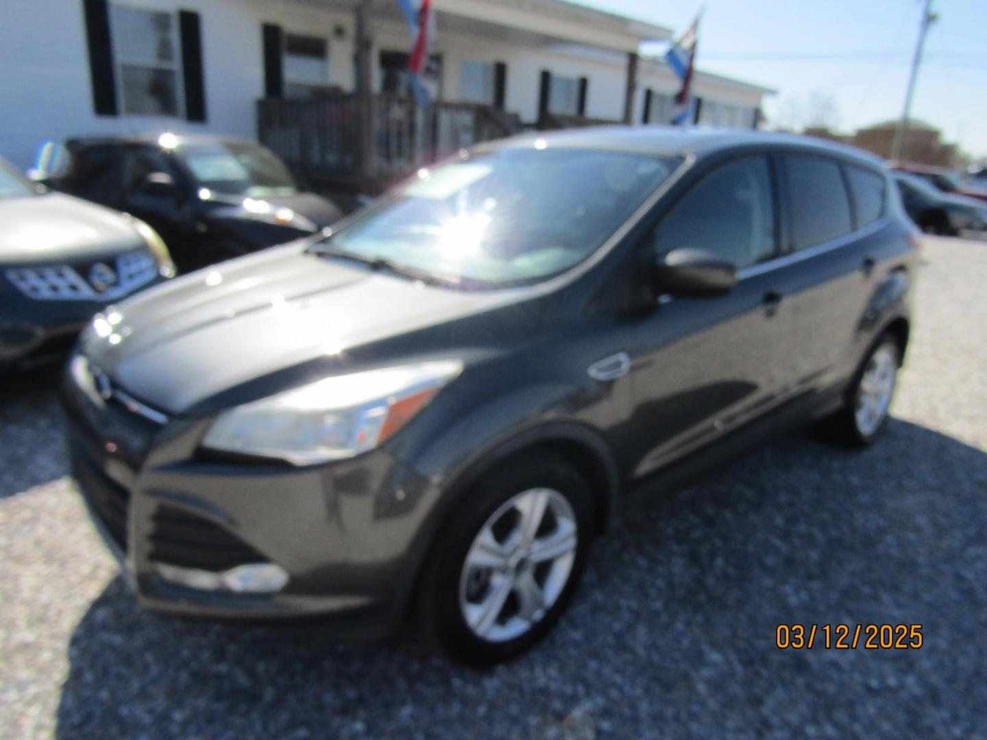 2016 Gray Ford Escape SE FWD (1FMCU0G99GU) with an 2.0L L4 DOHC 16V engine, Automatic transmission, located at 15016 S Hwy 231, Midland City, AL, 36350, (334) 983-3001, 31.306210, -85.495277 - Photo#1