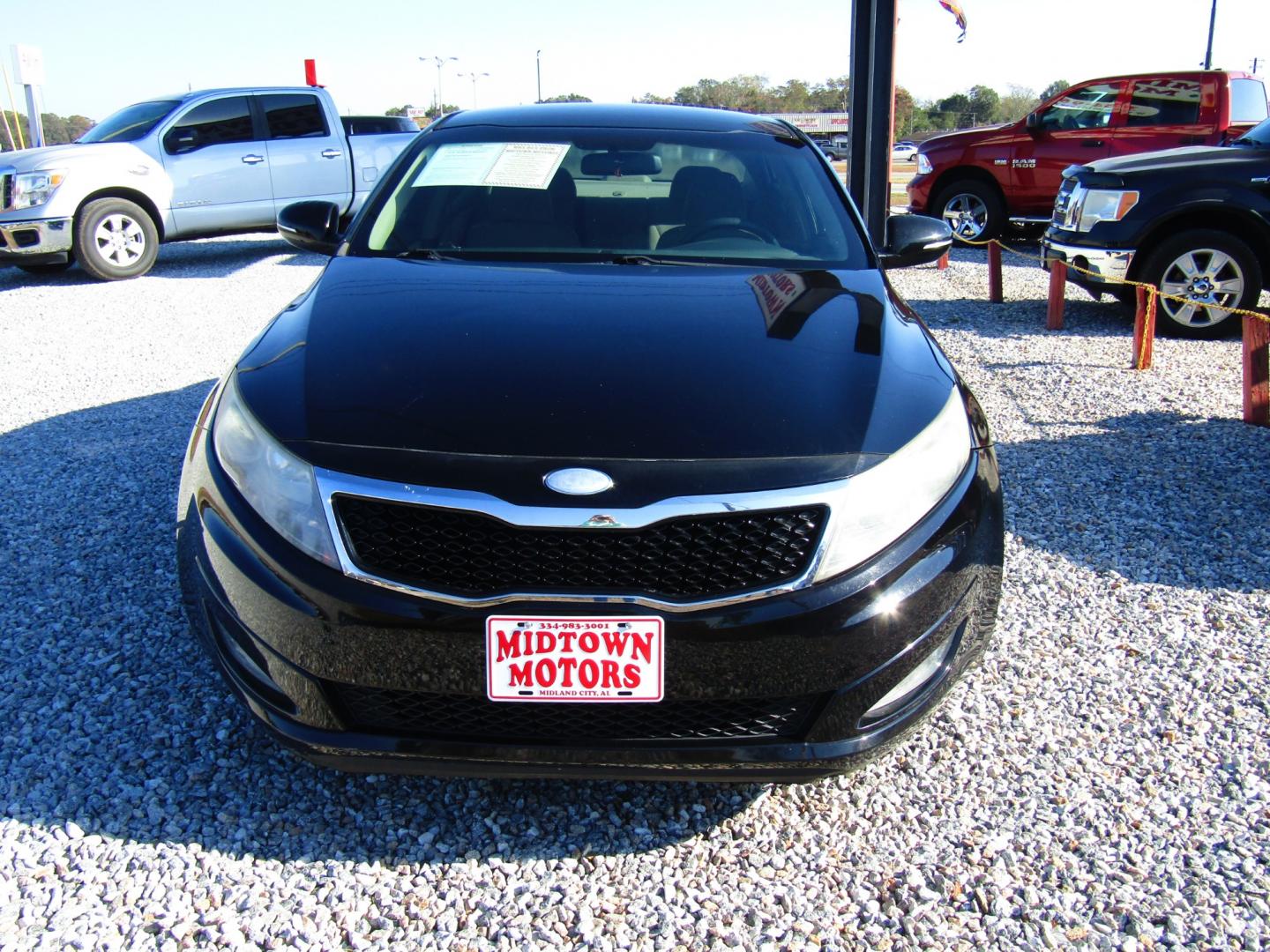 2013 Black Kia Optima LX MT (5XXGM4A72DG) with an 2.4L L4 DOHC 16V engine, 5-Speed Manual transmission, located at 15016 S Hwy 231, Midland City, AL, 36350, (334) 983-3001, 31.306210, -85.495277 - Photo#1