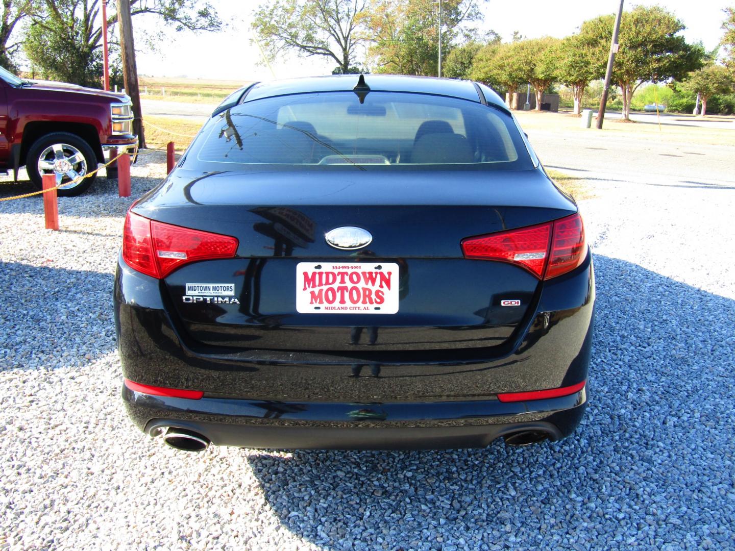 2013 Black Kia Optima LX MT (5XXGM4A72DG) with an 2.4L L4 DOHC 16V engine, 5-Speed Manual transmission, located at 15016 S Hwy 231, Midland City, AL, 36350, (334) 983-3001, 31.306210, -85.495277 - Photo#6