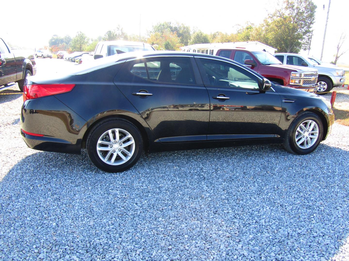 2013 Black Kia Optima LX MT (5XXGM4A72DG) with an 2.4L L4 DOHC 16V engine, 5-Speed Manual transmission, located at 15016 S Hwy 231, Midland City, AL, 36350, (334) 983-3001, 31.306210, -85.495277 - Photo#7