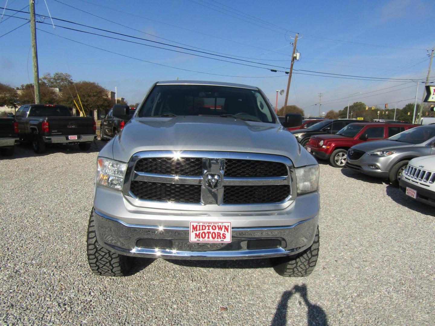 2014 Silver RAM 1500 SLT Quad Cab 4WD (1C6RR7GT9ES) with an 5.7L V8 OHV 16V engine, Automatic transmission, located at 15016 S Hwy 231, Midland City, AL, 36350, (334) 983-3001, 31.306210, -85.495277 - Photo#1