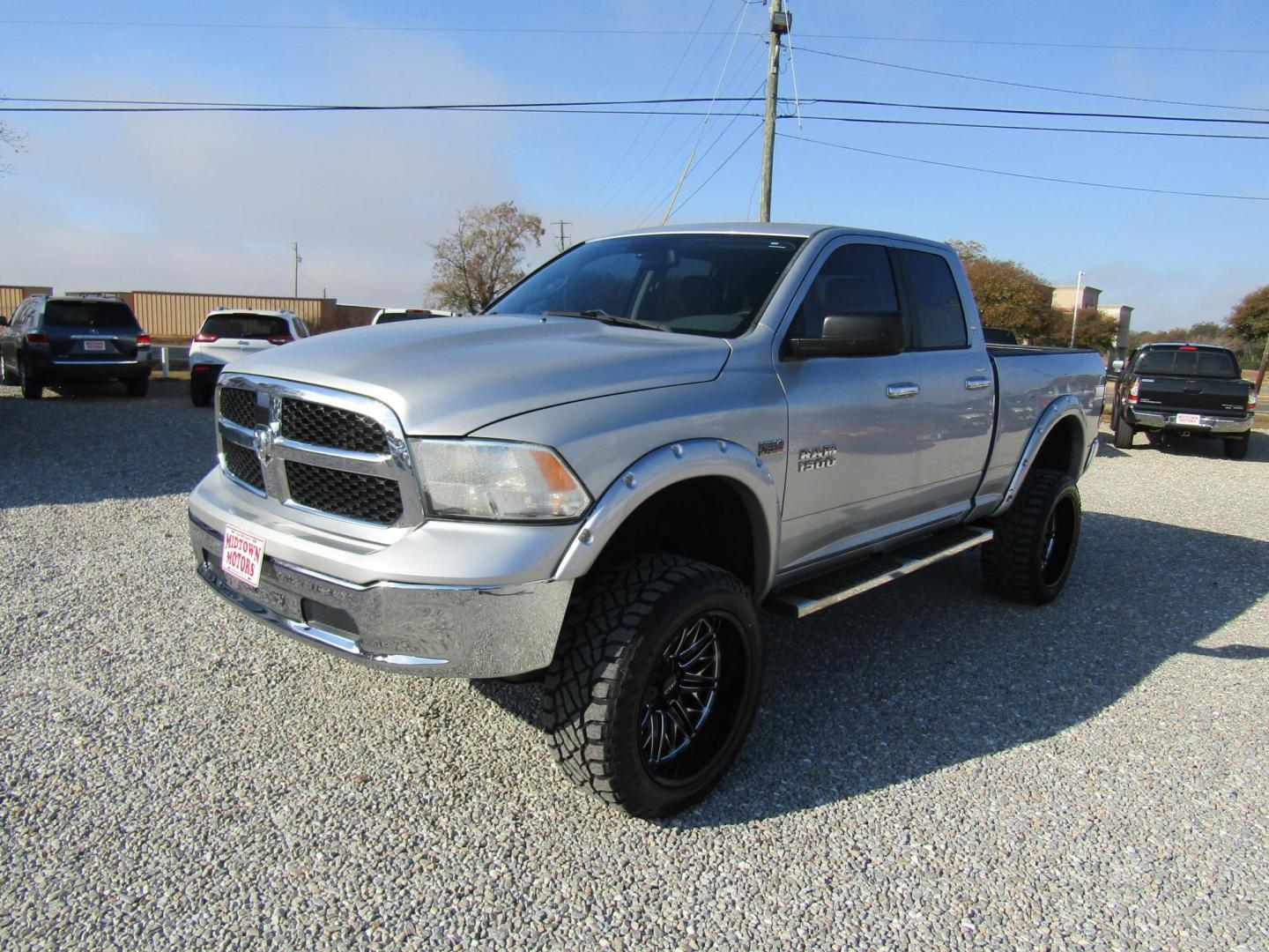 2014 Silver RAM 1500 SLT Quad Cab 4WD (1C6RR7GT9ES) with an 5.7L V8 OHV 16V engine, Automatic transmission, located at 15016 S Hwy 231, Midland City, AL, 36350, (334) 983-3001, 31.306210, -85.495277 - Photo#2