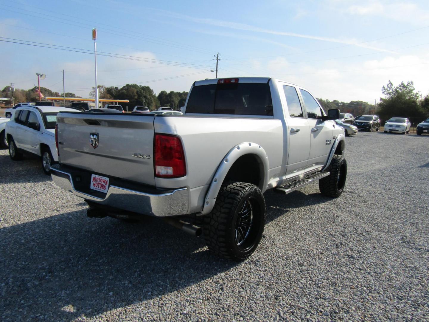 2014 Silver RAM 1500 SLT Quad Cab 4WD (1C6RR7GT9ES) with an 5.7L V8 OHV 16V engine, Automatic transmission, located at 15016 S Hwy 231, Midland City, AL, 36350, (334) 983-3001, 31.306210, -85.495277 - Photo#7