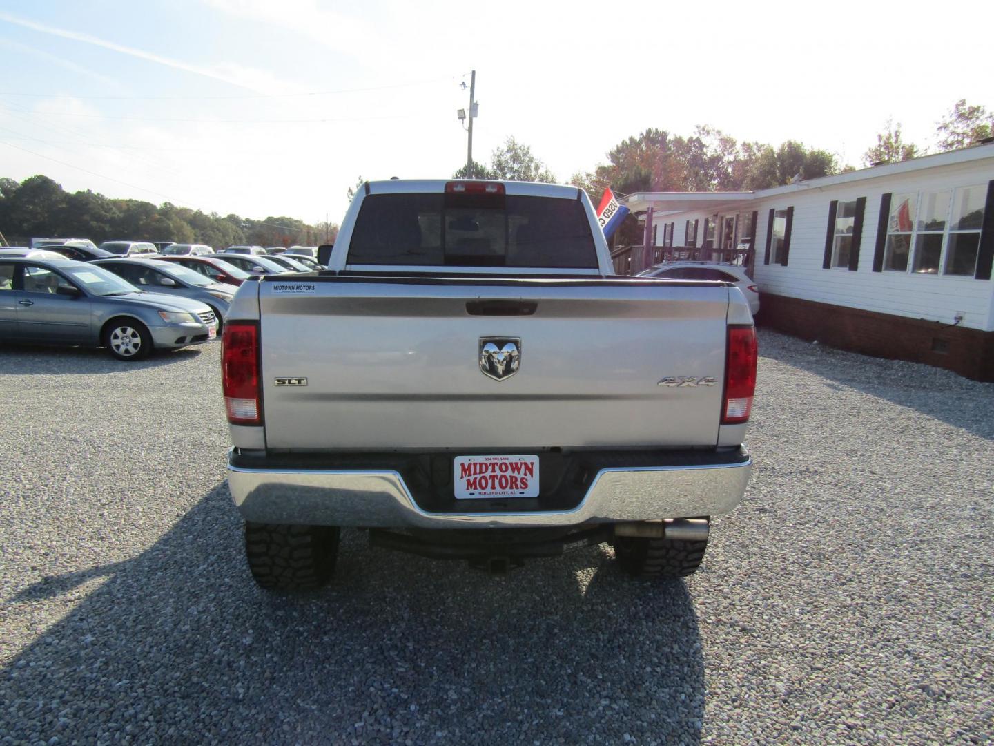 2014 Silver RAM 1500 SLT Quad Cab 4WD (1C6RR7GT9ES) with an 5.7L V8 OHV 16V engine, Automatic transmission, located at 15016 S Hwy 231, Midland City, AL, 36350, (334) 983-3001, 31.306210, -85.495277 - Photo#6