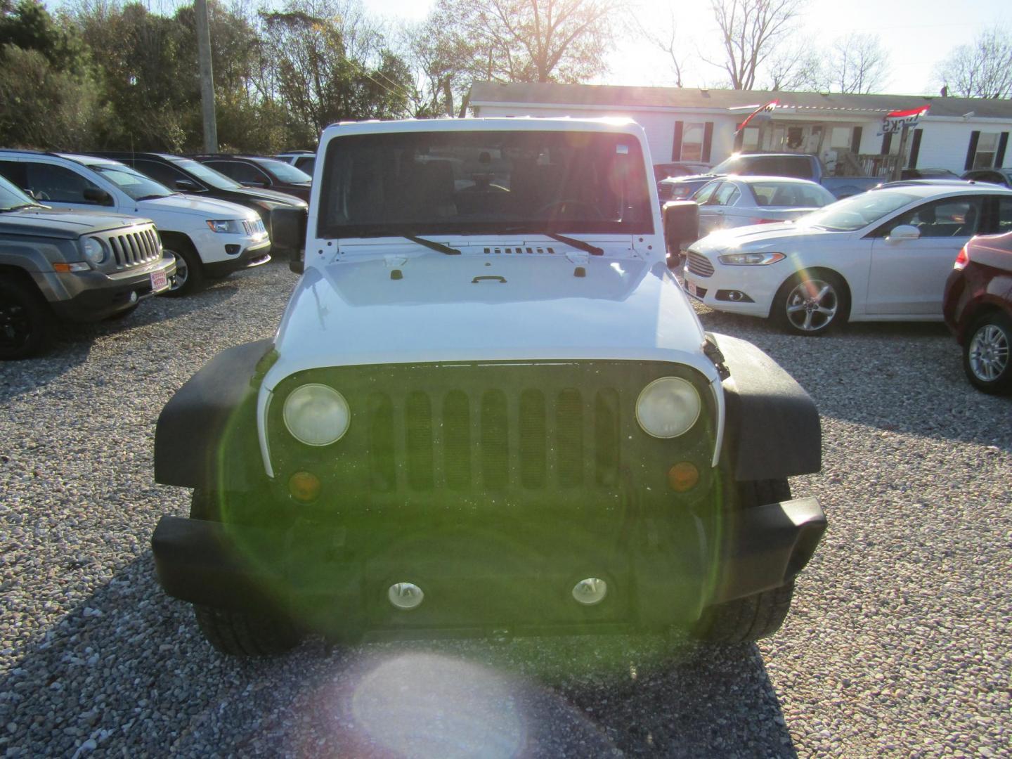 2011 White Jeep Wrangler Sport 4WD (1J4AA2D13BL) with an 3.8L V6 OHV 12V engine, Automatic transmission, located at 15016 S Hwy 231, Midland City, AL, 36350, (334) 983-3001, 31.306210, -85.495277 - Photo#1