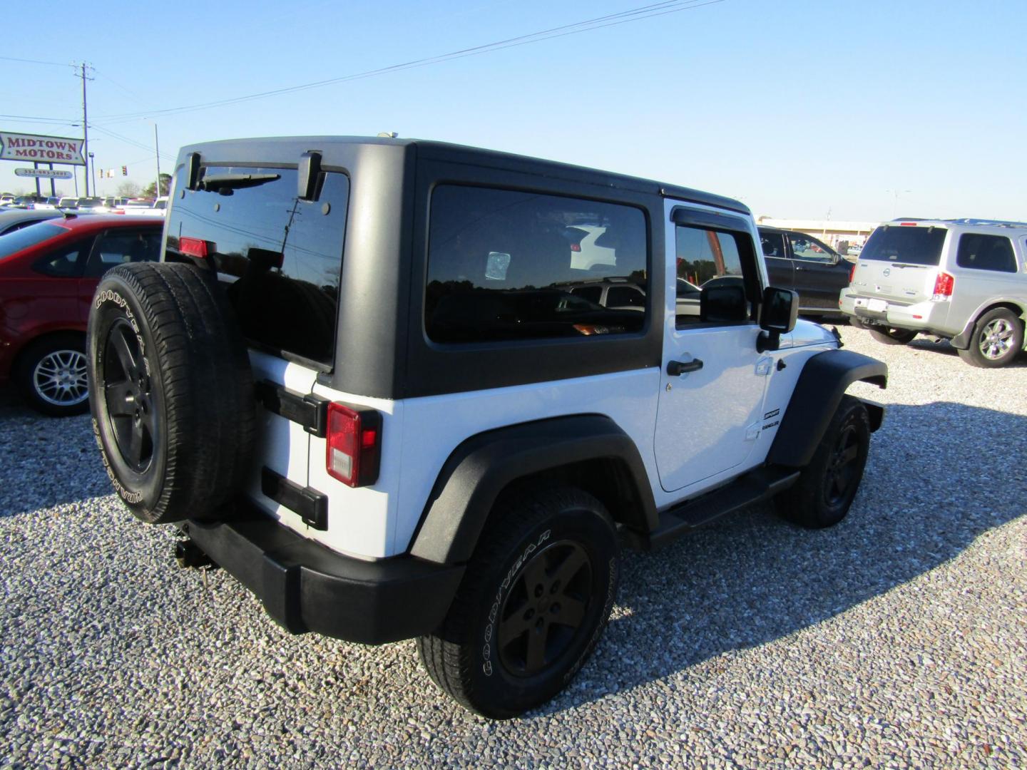 2011 White Jeep Wrangler Sport 4WD (1J4AA2D13BL) with an 3.8L V6 OHV 12V engine, Automatic transmission, located at 15016 S Hwy 231, Midland City, AL, 36350, (334) 983-3001, 31.306210, -85.495277 - Photo#5
