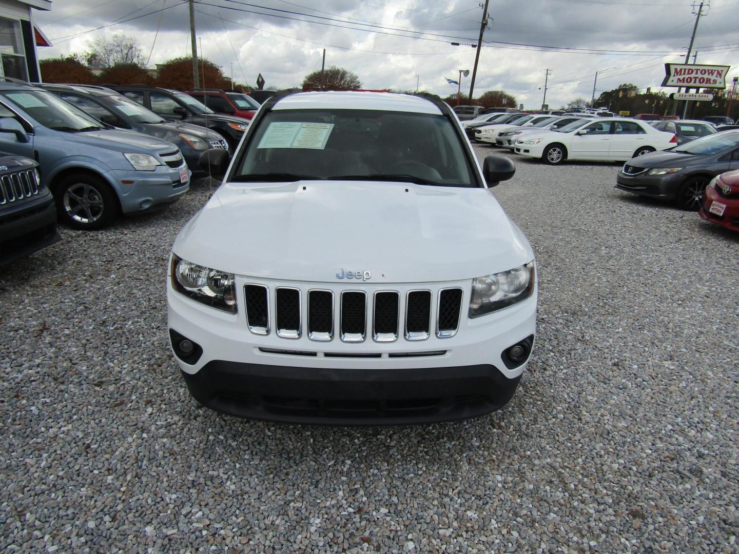 2016 White Jeep Compass Sport FWD (1C4NJCBA7GD) with an 2.0L L4 DOHC 16V engine, Automatic transmission, located at 15016 S Hwy 231, Midland City, AL, 36350, (334) 983-3001, 31.306210, -85.495277 - Photo#2