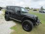 2014 Black Jeep Wrangler Unlimited Sport 4WD (1C4BJWDG7EL) with an 3.6L V6 DOHC 24V FFV engine, Automatic transmission, located at 15016 S Hwy 231, Midland City, AL, 36350, (334) 983-3001, 31.306210, -85.495277 - Photo#0