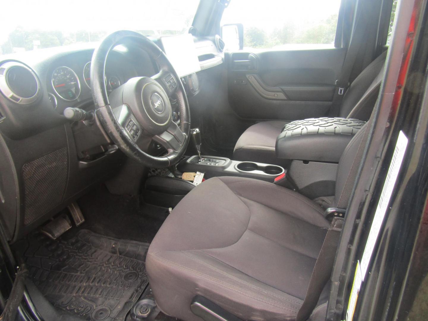2014 Black Jeep Wrangler Unlimited Sport 4WD (1C4BJWDG7EL) with an 3.6L V6 DOHC 24V FFV engine, Automatic transmission, located at 15016 S Hwy 231, Midland City, AL, 36350, (334) 983-3001, 31.306210, -85.495277 - Photo#2