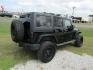 2014 Black Jeep Wrangler Unlimited Sport 4WD (1C4BJWDG7EL) with an 3.6L V6 DOHC 24V FFV engine, Automatic transmission, located at 15016 S Hwy 231, Midland City, AL, 36350, (334) 983-3001, 31.306210, -85.495277 - Photo#5