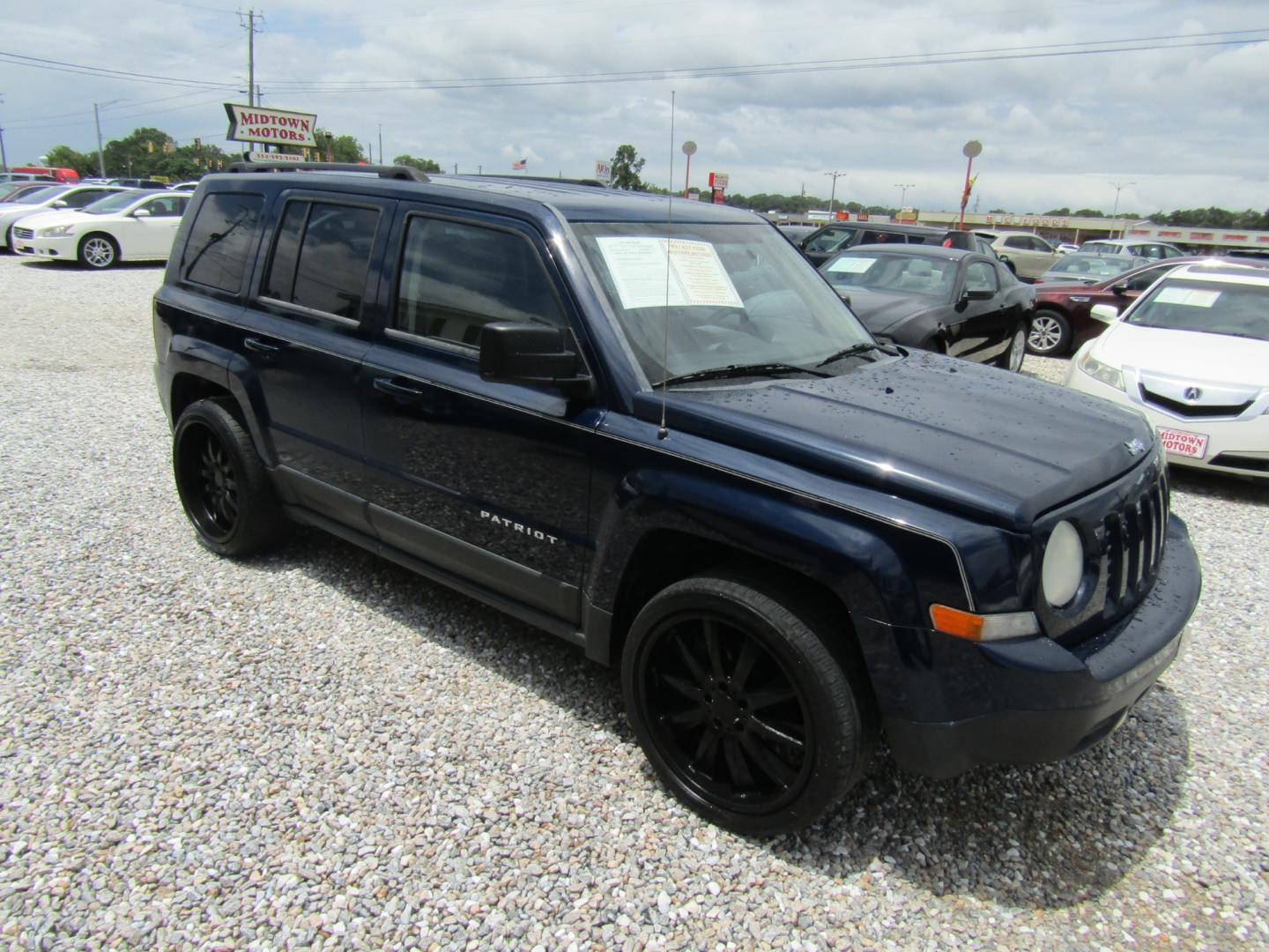 2012 Blue /Tan Jeep Patriot Sport 2WD (1C4NJPBA1CD) with an 2.0L L4 DOHC 16V engine, Automatic transmission, located at 15016 S Hwy 231, Midland City, AL, 36350, (334) 983-3001, 31.306210, -85.495277 - Photo#0