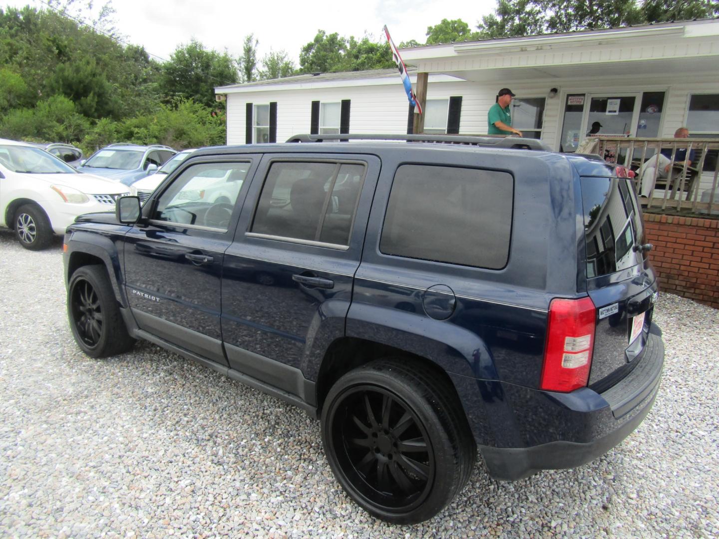 2012 Blue /Tan Jeep Patriot Sport 2WD (1C4NJPBA1CD) with an 2.0L L4 DOHC 16V engine, Automatic transmission, located at 15016 S Hwy 231, Midland City, AL, 36350, (334) 983-3001, 31.306210, -85.495277 - Photo#5