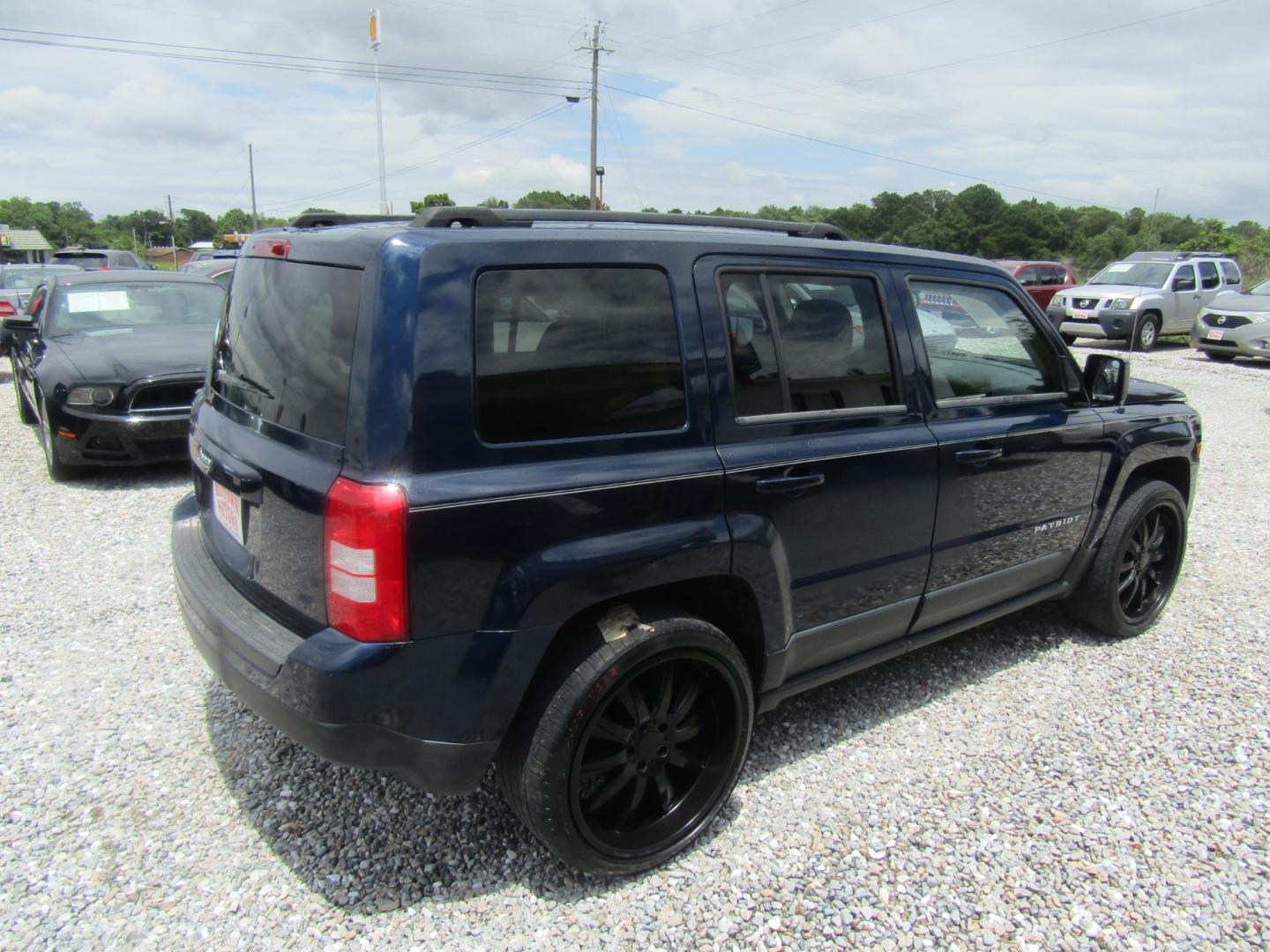 2012 Blue /Tan Jeep Patriot Sport 2WD (1C4NJPBA1CD) with an 2.0L L4 DOHC 16V engine, Automatic transmission, located at 15016 S Hwy 231, Midland City, AL, 36350, (334) 983-3001, 31.306210, -85.495277 - Photo#7