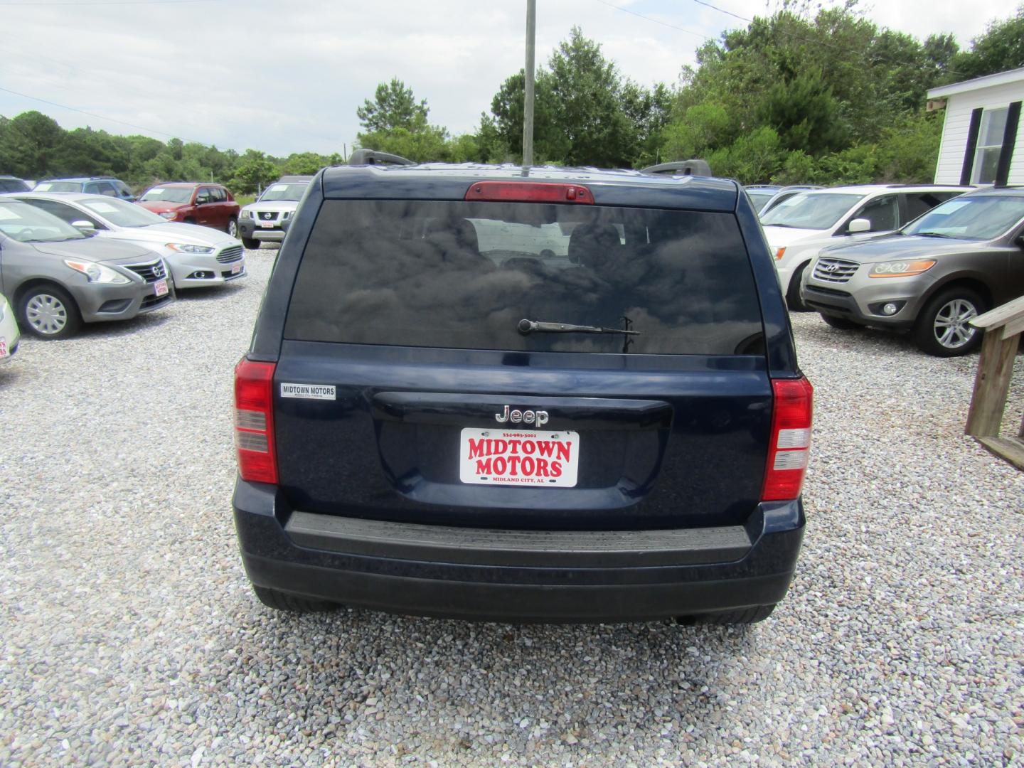 2012 Blue /Tan Jeep Patriot Sport 2WD (1C4NJPBA1CD) with an 2.0L L4 DOHC 16V engine, Automatic transmission, located at 15016 S Hwy 231, Midland City, AL, 36350, (334) 983-3001, 31.306210, -85.495277 - Photo#6