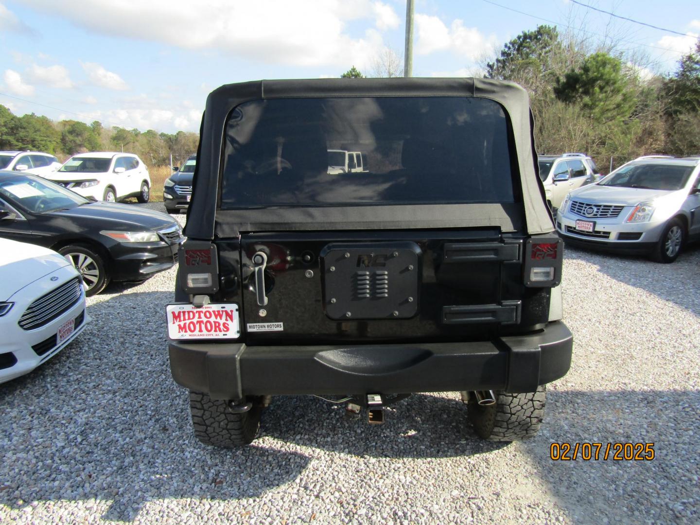 2012 Black /Black Jeep Wrangler Sport 4WD (1C4AJWAG8CL) with an 3.6L V6 DOHC 24V FFV engine, Automatic transmission, located at 15016 S Hwy 231, Midland City, AL, 36350, (334) 983-3001, 31.306210, -85.495277 - Photo#5