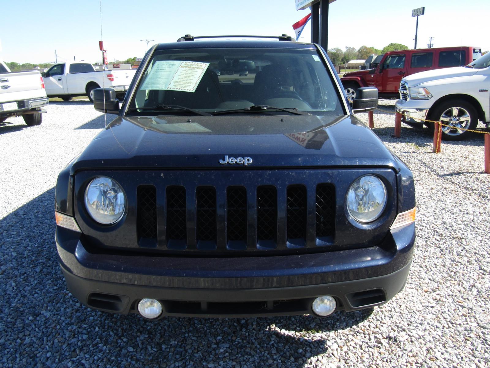 2015 Blue Jeep Patriot Latitude 2WD (1C4NJPFB6FD) with an 2.4L L4 DOHC 16V engine, Automatic transmission, located at 15016 S Hwy 231, Midland City, AL, 36350, (334) 983-3001, 31.306210, -85.495277 - Photo #1