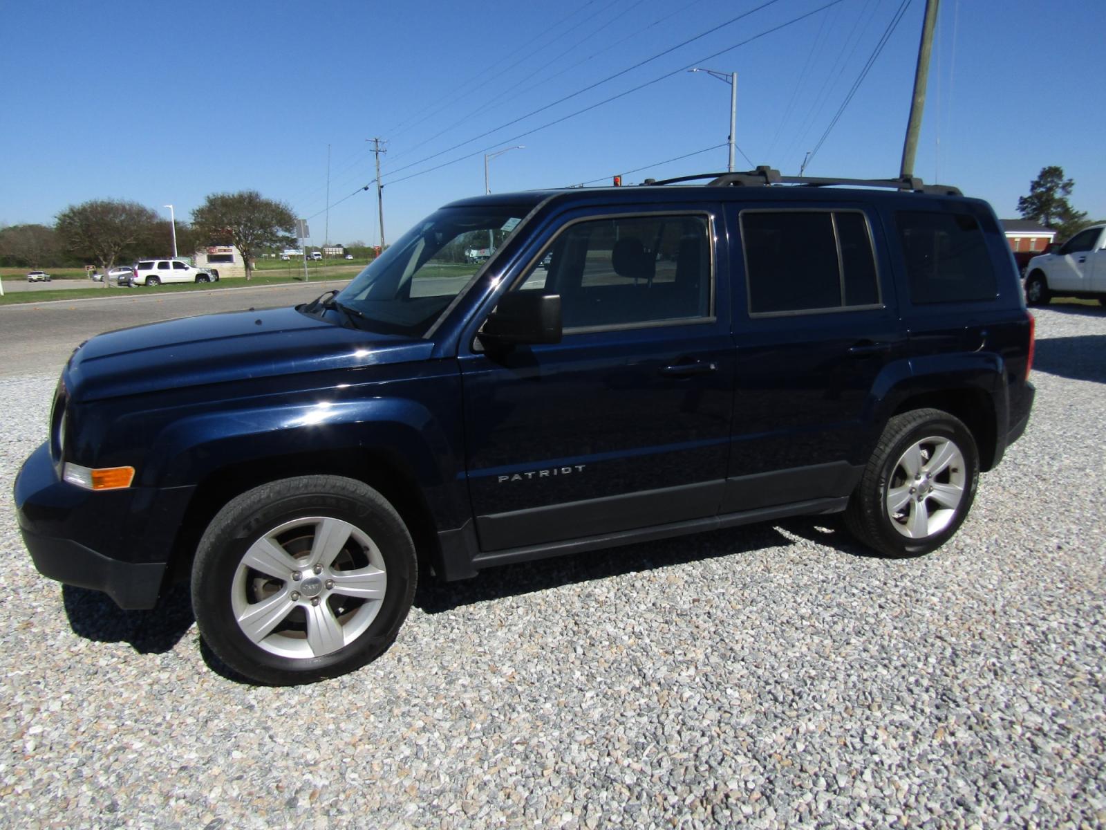 2015 Blue Jeep Patriot Latitude 2WD (1C4NJPFB6FD) with an 2.4L L4 DOHC 16V engine, Automatic transmission, located at 15016 S Hwy 231, Midland City, AL, 36350, (334) 983-3001, 31.306210, -85.495277 - Photo #2