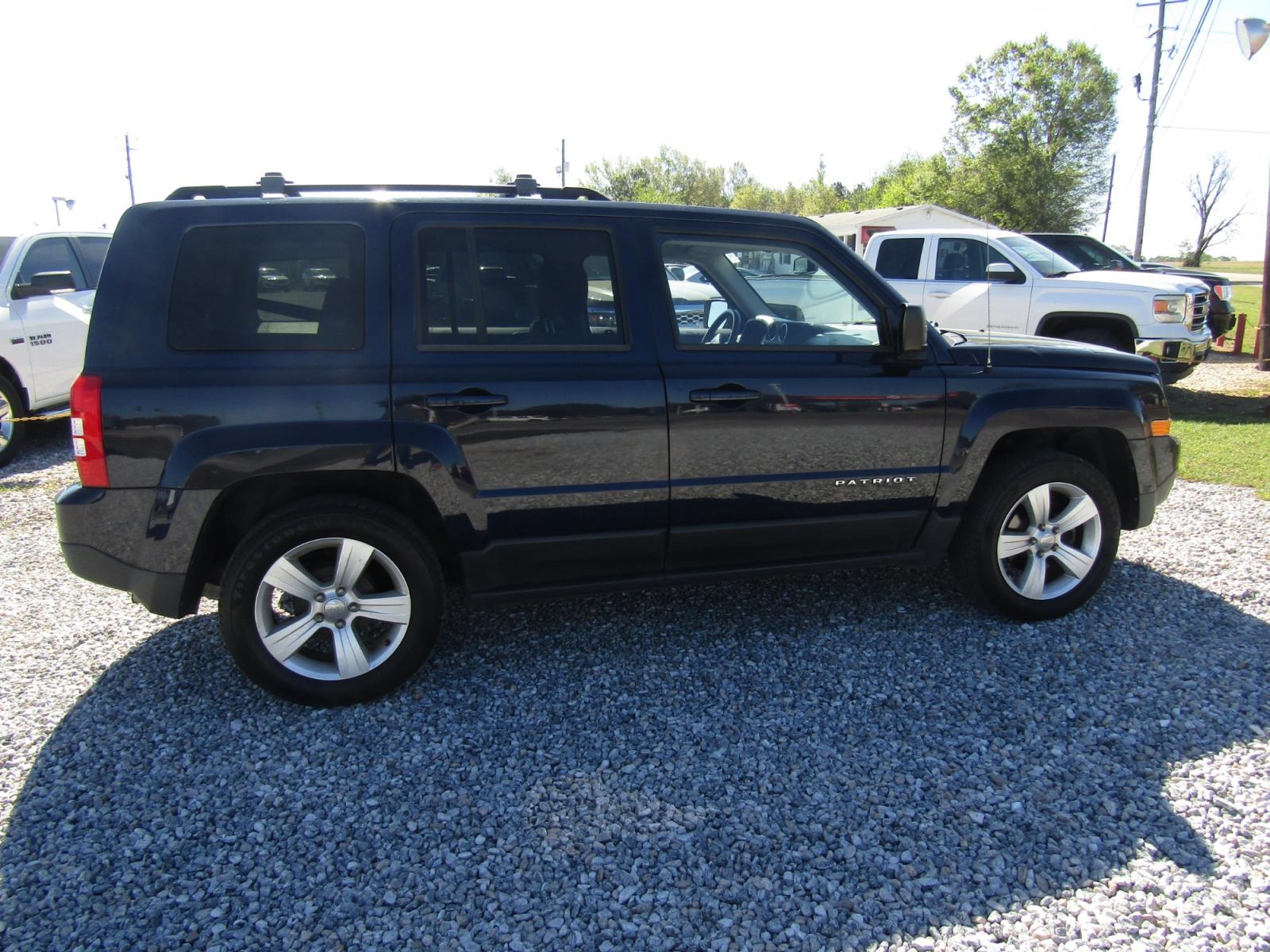 2015 Blue Jeep Patriot Latitude 2WD (1C4NJPFB6FD) with an 2.4L L4 DOHC 16V engine, Automatic transmission, located at 15016 S Hwy 231, Midland City, AL, 36350, (334) 983-3001, 31.306210, -85.495277 - Photo #8