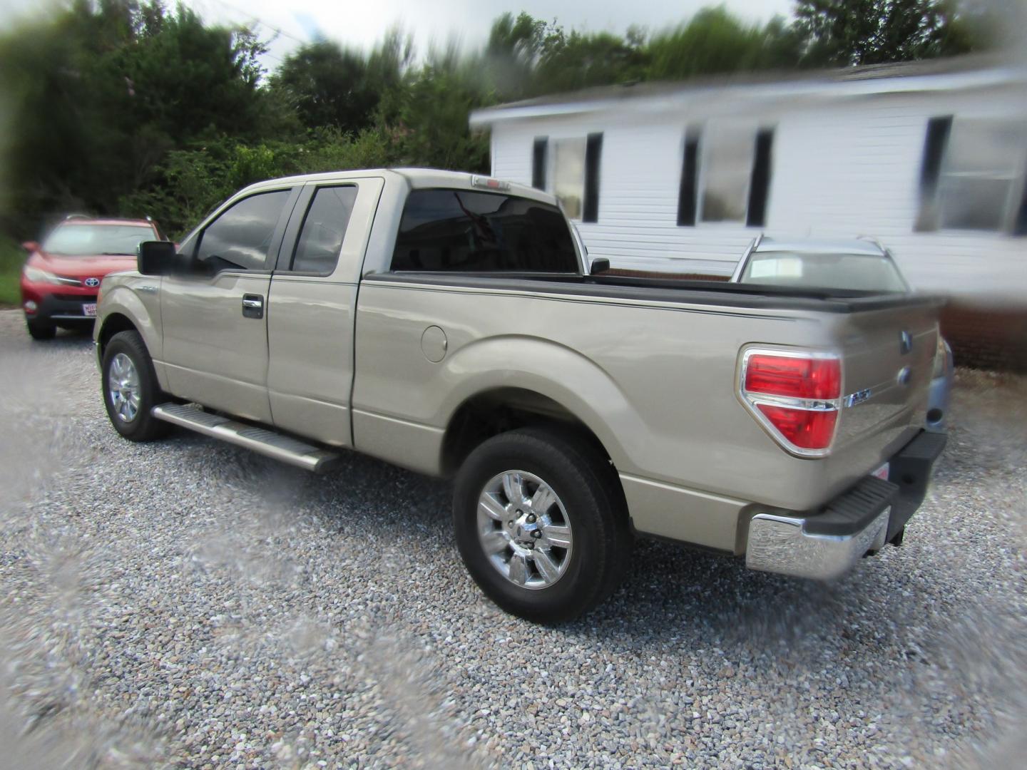 2010 Gold Ford F-150 Lariat SuperCab 6.5-ft. Bed 2WD (1FTEX1C87AF) with an 4.6L V8 SOHC 24V engine, Automatic transmission, located at 15016 S Hwy 231, Midland City, AL, 36350, (334) 983-3001, 31.306210, -85.495277- Photo#4