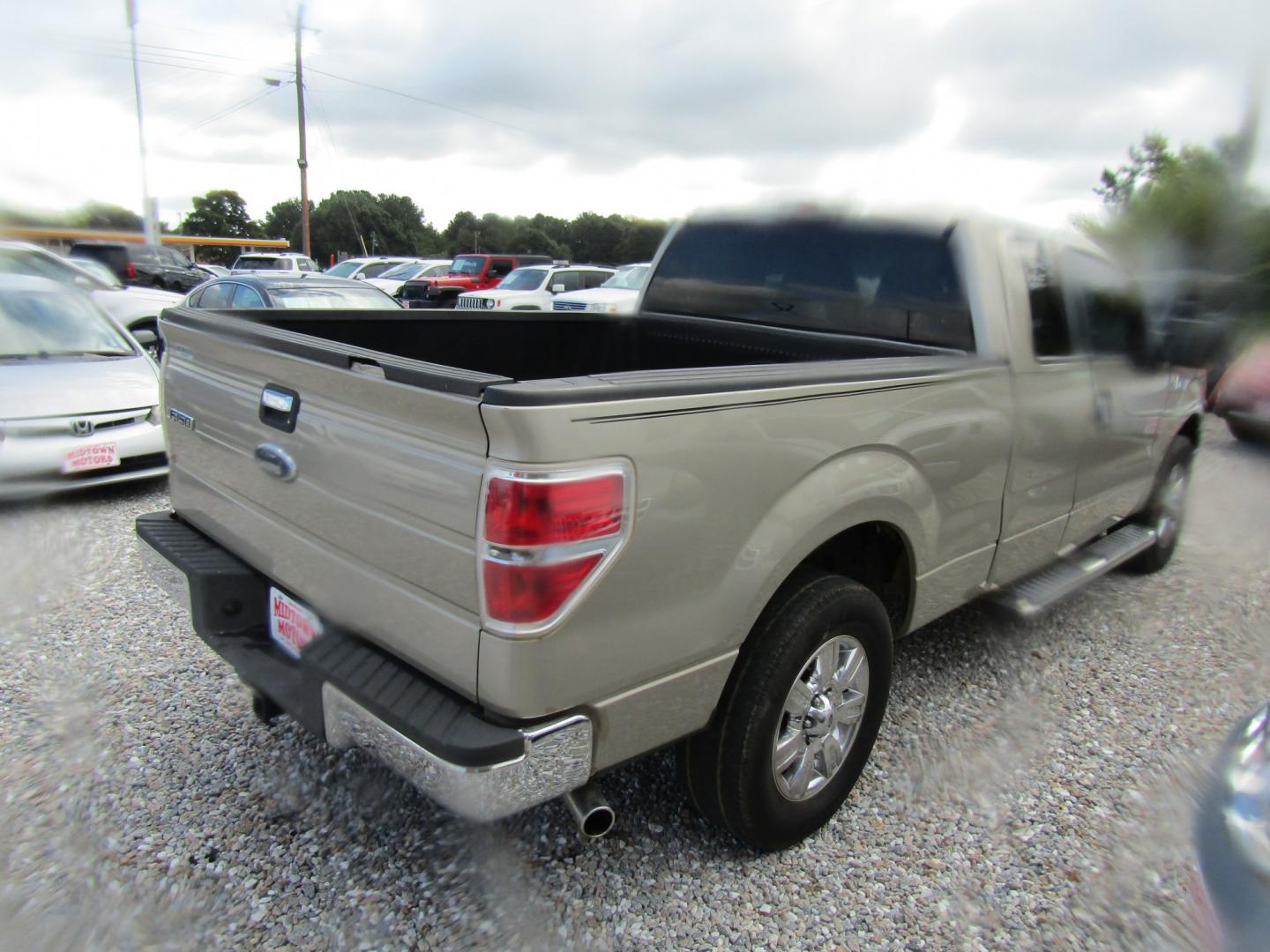 2010 Gold Ford F-150 Lariat SuperCab 6.5-ft. Bed 2WD (1FTEX1C87AF) with an 4.6L V8 SOHC 24V engine, Automatic transmission, located at 15016 S Hwy 231, Midland City, AL, 36350, (334) 983-3001, 31.306210, -85.495277- Photo#6