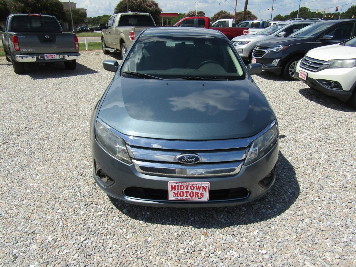 2011 Blue /TAN Ford Fusion I4 SE (3FAHP0HA9BR) with an 2.5L L4 DOHC 16V engine, Automatic transmission, located at 15016 S Hwy 231, Midland City, AL, 36350, (334) 983-3001, 31.306210, -85.495277- Photo#1