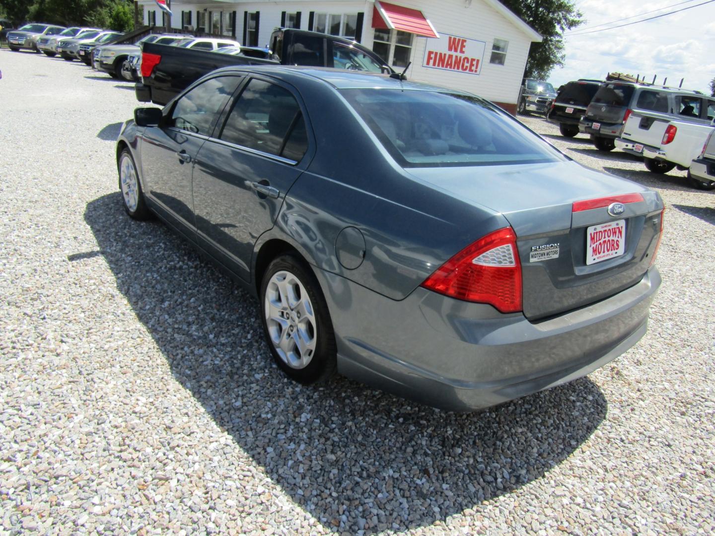 2011 Blue /TAN Ford Fusion I4 SE (3FAHP0HA9BR) with an 2.5L L4 DOHC 16V engine, Automatic transmission, located at 15016 S Hwy 231, Midland City, AL, 36350, (334) 983-3001, 31.306210, -85.495277- Photo#5