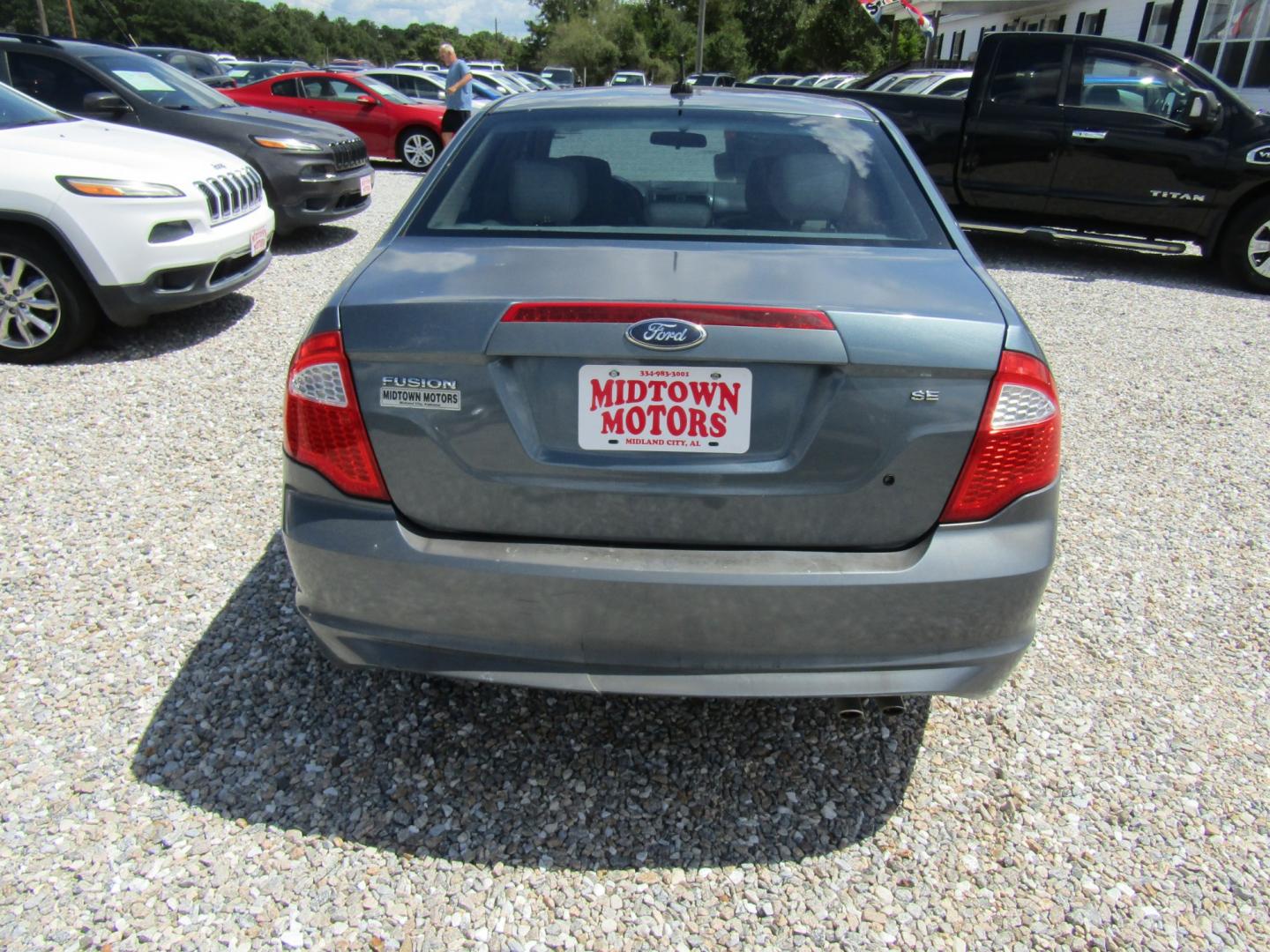 2011 Blue /TAN Ford Fusion I4 SE (3FAHP0HA9BR) with an 2.5L L4 DOHC 16V engine, Automatic transmission, located at 15016 S Hwy 231, Midland City, AL, 36350, (334) 983-3001, 31.306210, -85.495277- Photo#6