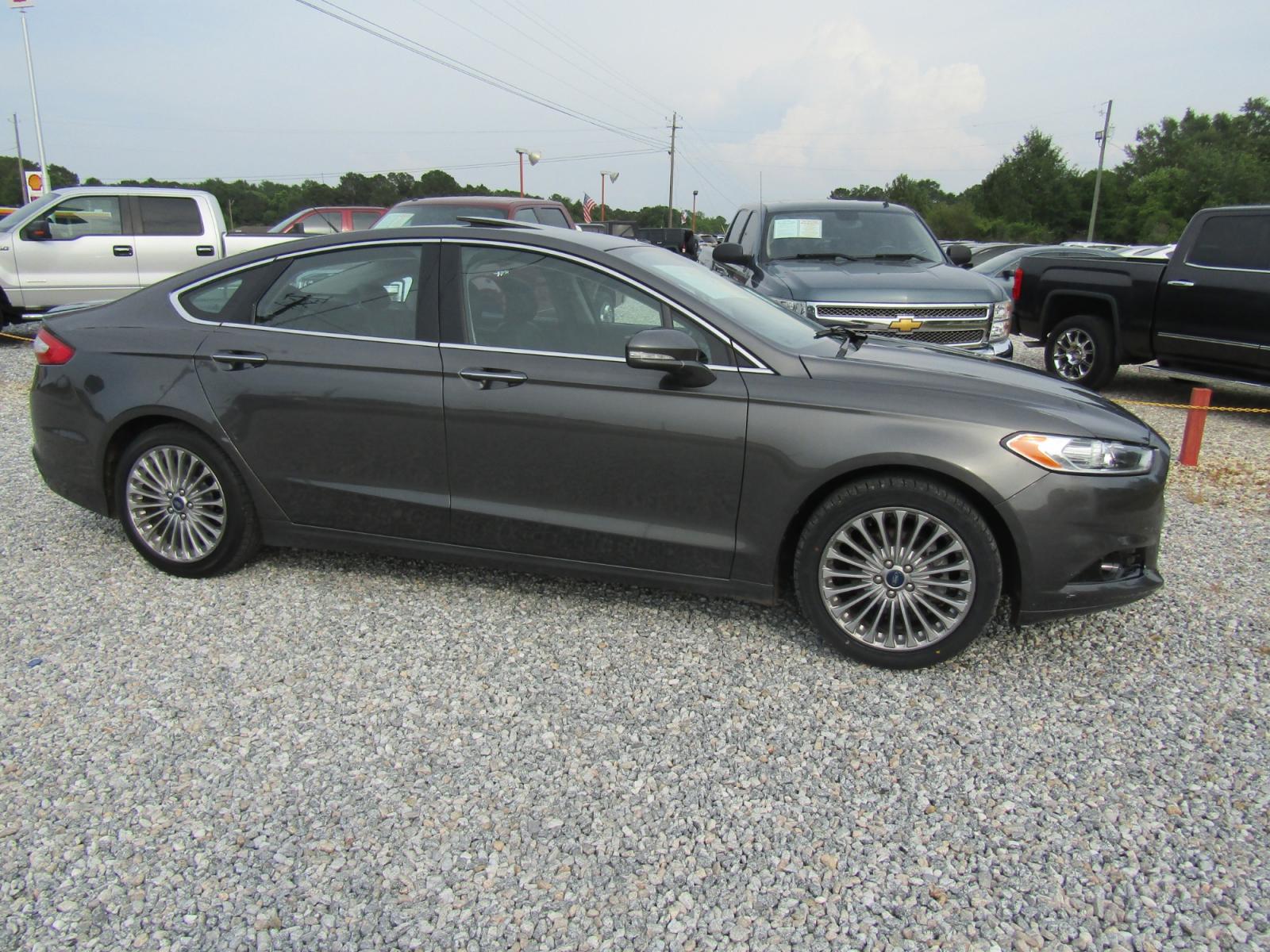 2016 Gray Ford Fusion Titanium (3FA6P0K97GR) with an 2.0L L4 DOHC 16V engine, Automatic transmission, located at 15016 S Hwy 231, Midland City, AL, 36350, (334) 983-3001, 31.306210, -85.495277 - Photo #0