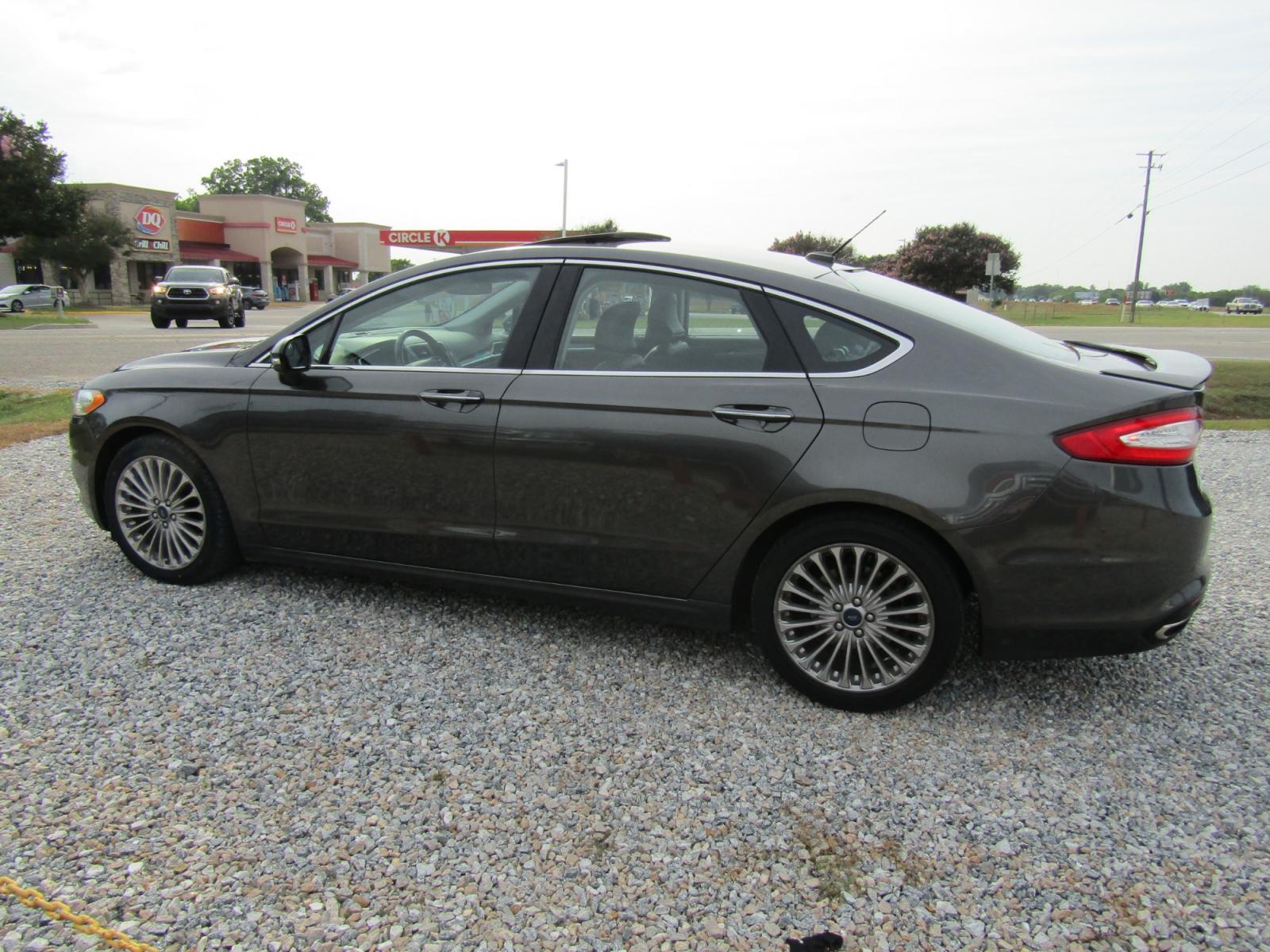 2016 Gray Ford Fusion Titanium (3FA6P0K97GR) with an 2.0L L4 DOHC 16V engine, Automatic transmission, located at 15016 S Hwy 231, Midland City, AL, 36350, (334) 983-3001, 31.306210, -85.495277 - Photo #5