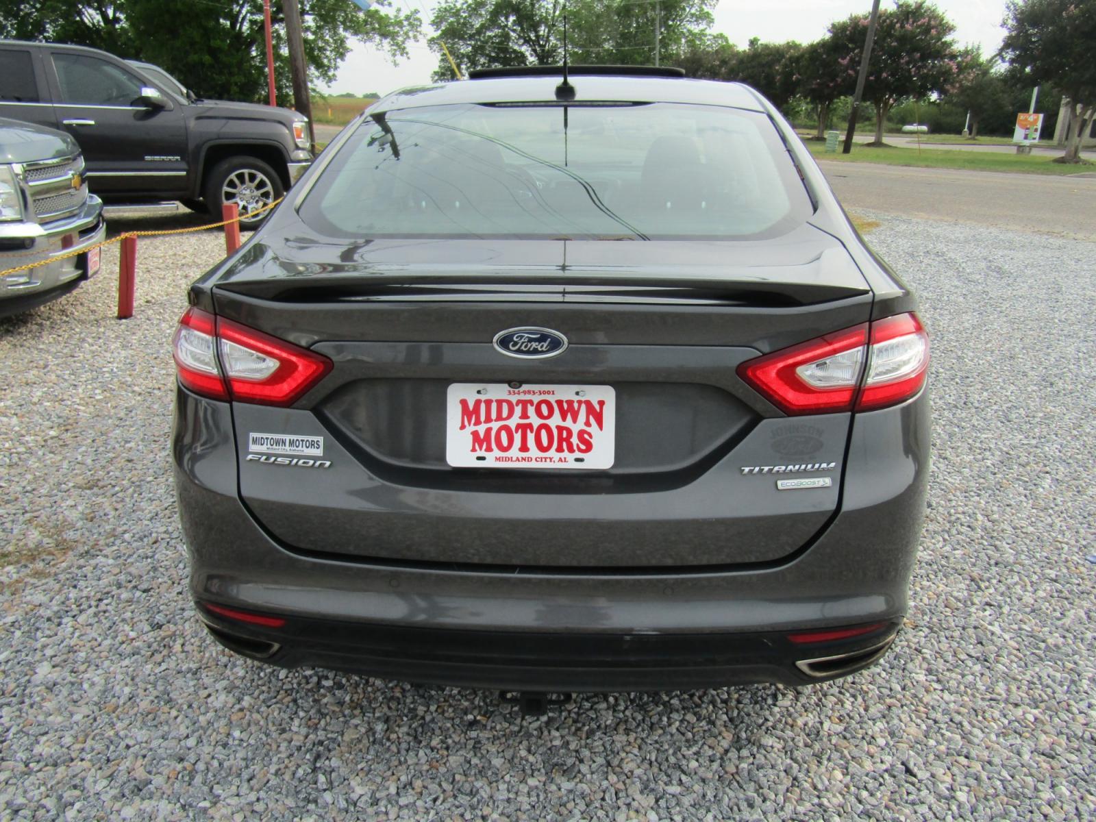 2016 Gray Ford Fusion Titanium (3FA6P0K97GR) with an 2.0L L4 DOHC 16V engine, Automatic transmission, located at 15016 S Hwy 231, Midland City, AL, 36350, (334) 983-3001, 31.306210, -85.495277 - Photo #6
