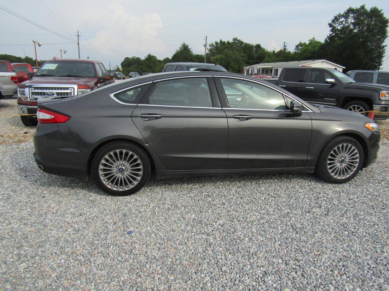 2016 Gray Ford Fusion Titanium (3FA6P0K97GR) with an 2.0L L4 DOHC 16V engine, Automatic transmission, located at 15016 S Hwy 231, Midland City, AL, 36350, (334) 983-3001, 31.306210, -85.495277 - Photo #7