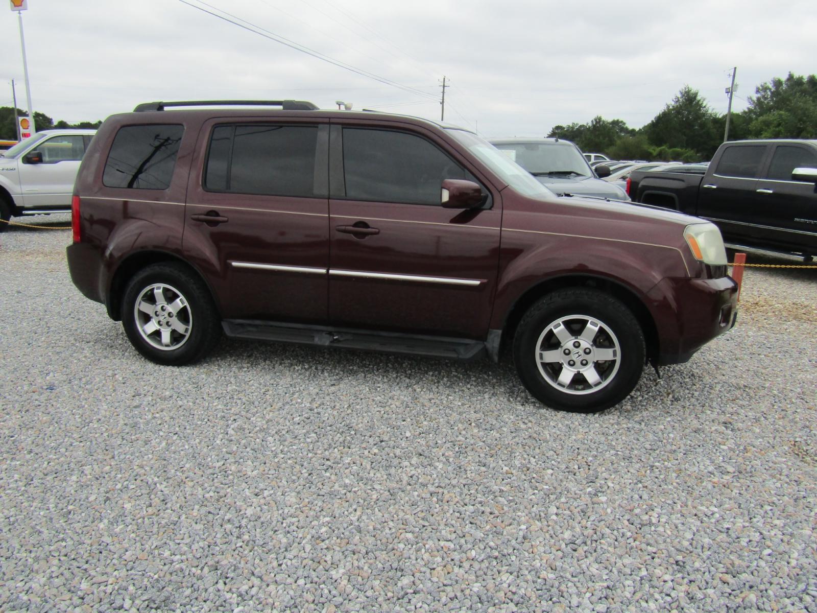 2011 Maroon Honda Pilot Touring 2WD 5-Spd AT with DVD (5FNYF3H96BB) with an 3.5L V6 SOHC 24V engine, Automatic transmission, located at 15016 S Hwy 231, Midland City, AL, 36350, (334) 983-3001, 31.306210, -85.495277 - Photo #0