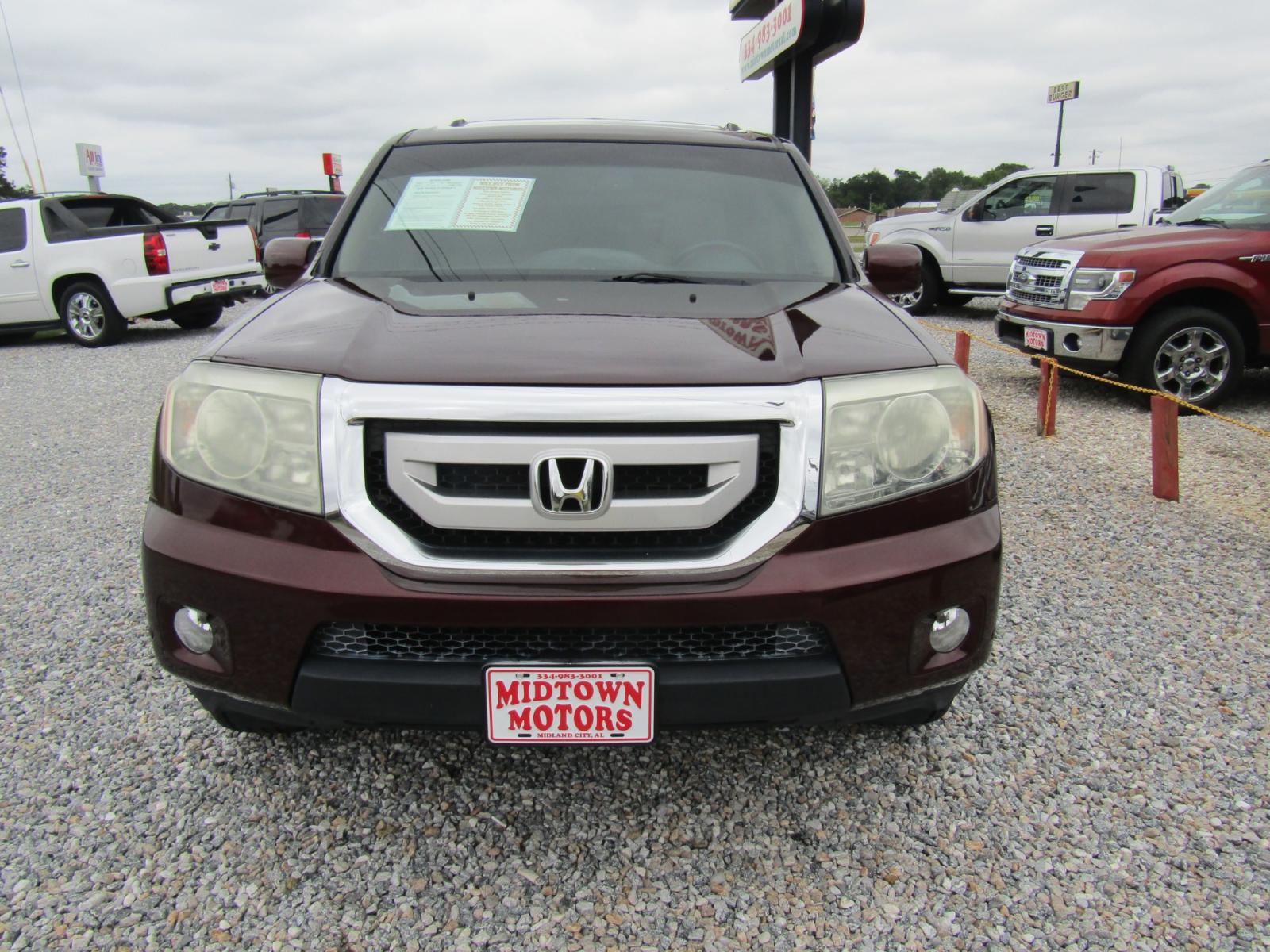 2011 Maroon Honda Pilot Touring 2WD 5-Spd AT with DVD (5FNYF3H96BB) with an 3.5L V6 SOHC 24V engine, Automatic transmission, located at 15016 S Hwy 231, Midland City, AL, 36350, (334) 983-3001, 31.306210, -85.495277 - Photo #1