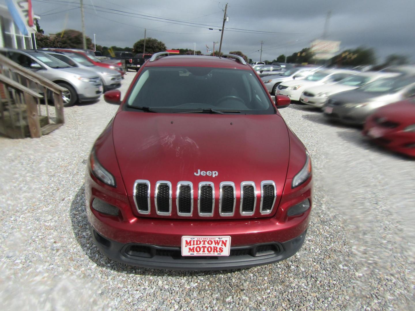 2015 Red Jeep Cherokee Latitude FWD (1C4PJLCS1FW) with an 3.2L V6 DOHC 24V engine, Automatic transmission, located at 15016 S Hwy 231, Midland City, AL, 36350, (334) 983-3001, 31.306210, -85.495277 - Photo#1