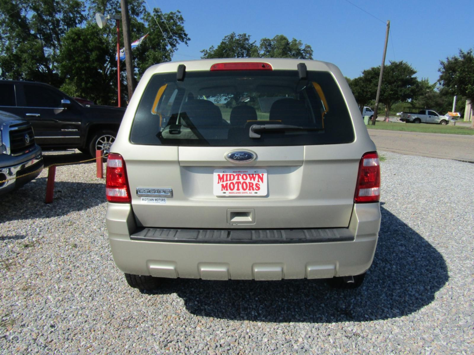 2010 Gold Ford Escape XLS FWD (1FMCU0C76AK) with an 2.5L L4 DOHC 16V engine, Automatic transmission, located at 15016 S Hwy 231, Midland City, AL, 36350, (334) 983-3001, 31.306210, -85.495277 - Photo #6