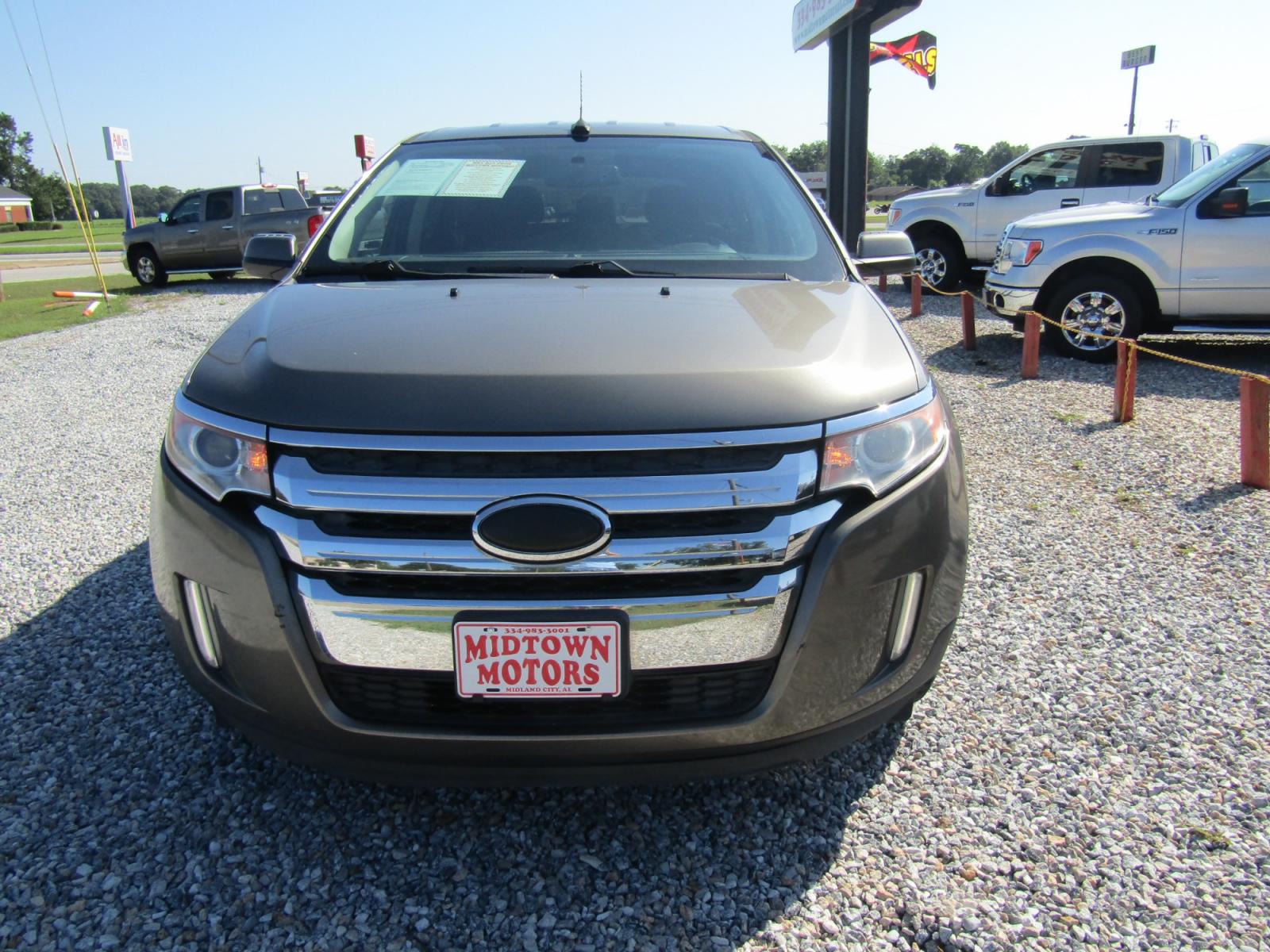 2013 Brown Ford Edge SEL FWD (2FMDK3JC2DB) with an 3.5L V6 DOHC 24V engine, Automatic transmission, located at 15016 S Hwy 231, Midland City, AL, 36350, (334) 983-3001, 31.306210, -85.495277 - Photo #1